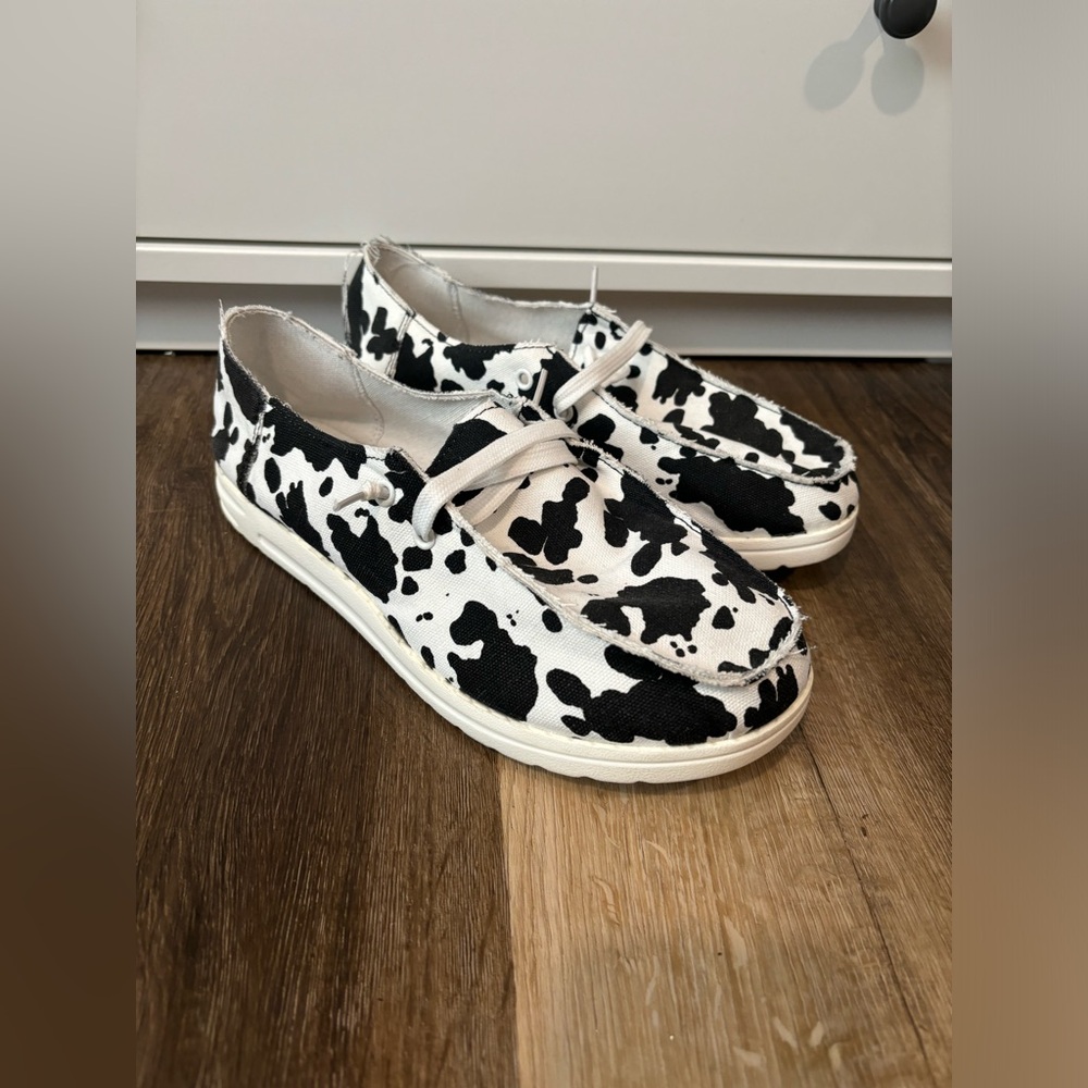 Cow print slip on shoes. worn once
